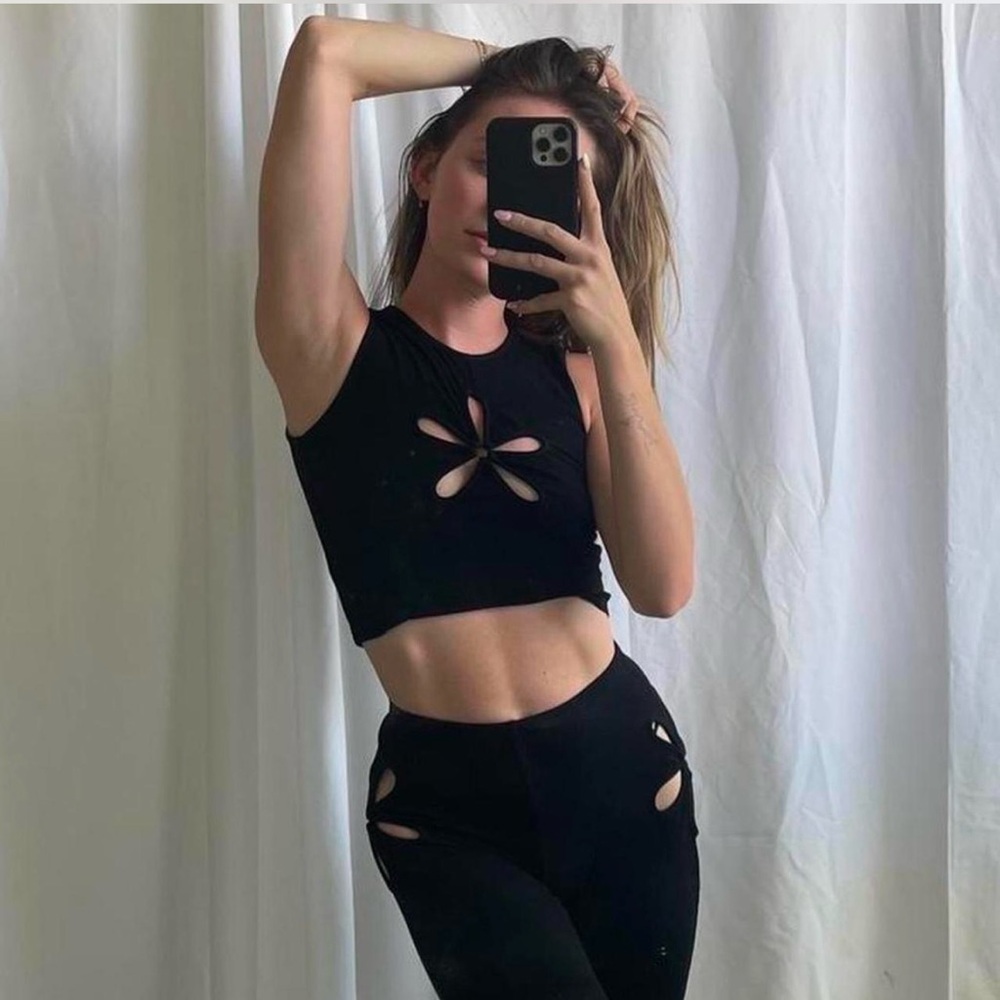 The Kript flower cut out tank top and high waisted flare pants ribbed stretchy